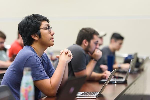 Students listen during a lecture.