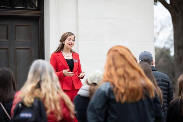 A Capstone Woman leads a campus tour